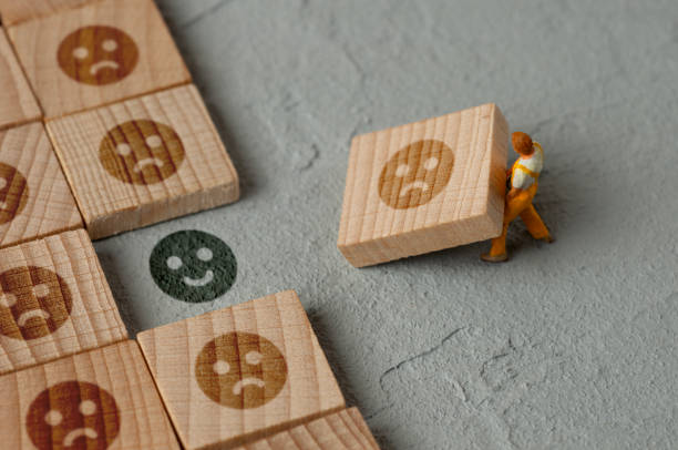 istock The hidden truth: sad/smile emoji 1687235381