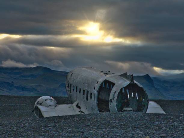 istock a large airplane in an open field with dark clouds behind it 1687237965