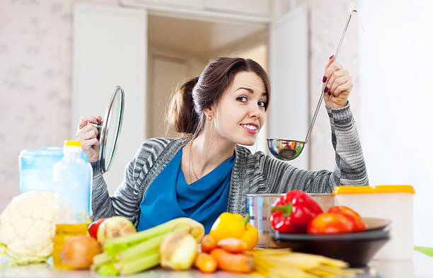 istock woman tests food with ladle 168724849