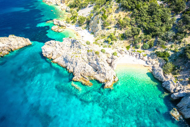istock Idyllic hidden beach near Lubenice aerial view 1687252602