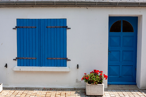 Traditional wooden door painted blue , stone house . Old village street in  Castrillo de los Polvazares, León, Castilla y León, Spain.