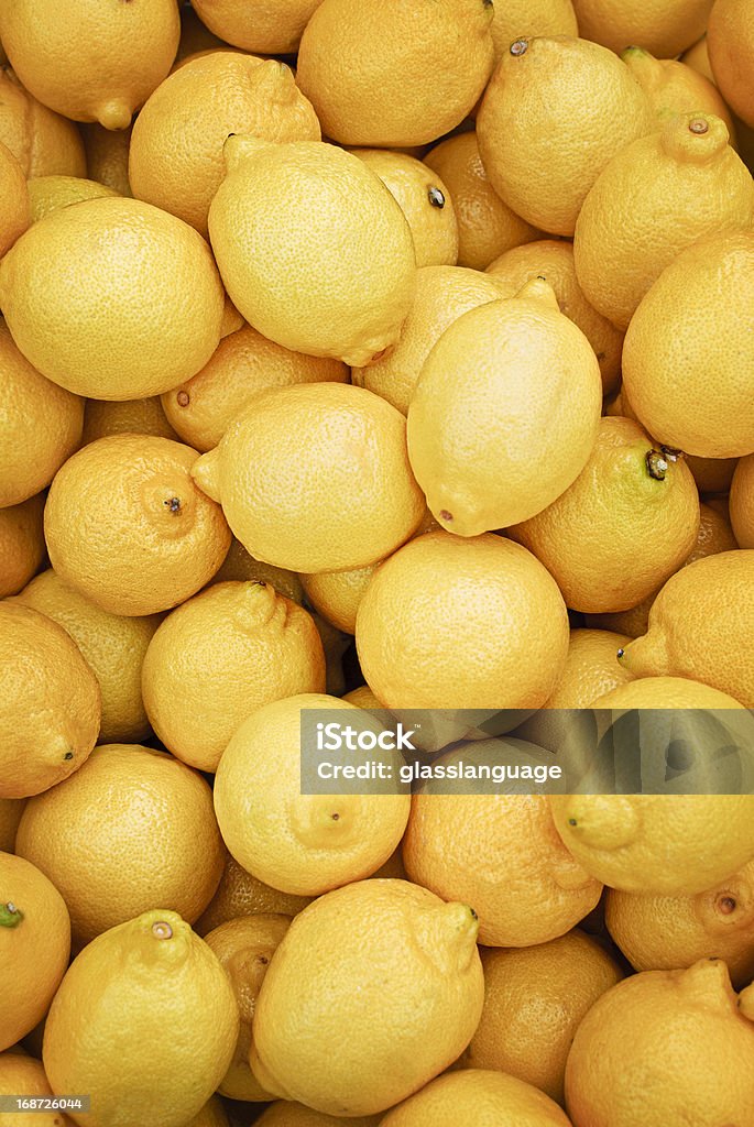 Lemons Close up shot of yellow lemons at  farmer's market. Selective focus, vertical. Citrus Fruit Stock Photo