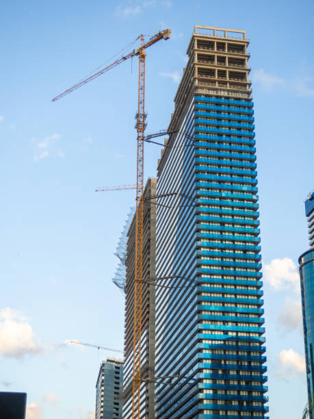 istock High-rise building under construction. Orbi city. Blue skyscraper. The tap is working. Completion of construction. Narrow high house. 1687263765