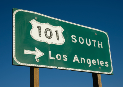 US 101 South Freeway sign points toward Los Angeles on a sunny day.