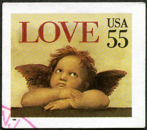 USA 1995 shows word "love" Cherub Sistine Madonna, Raphael USA 1995 stamp printed in USA shows word "love" and Cherub from Sistine Madonna, by Raphael, circa 1995 cherub stock pictures, royalty-free photos & images