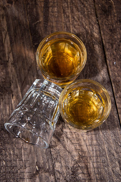 istock Three Glasses of Rum on wood 168729604