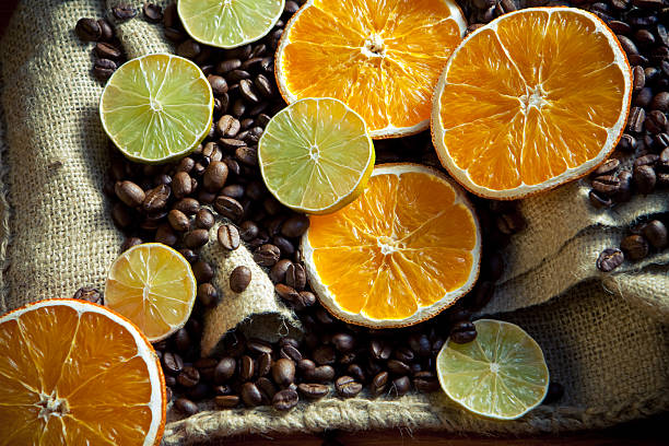 Coffee beans with orange and lemon stock photo