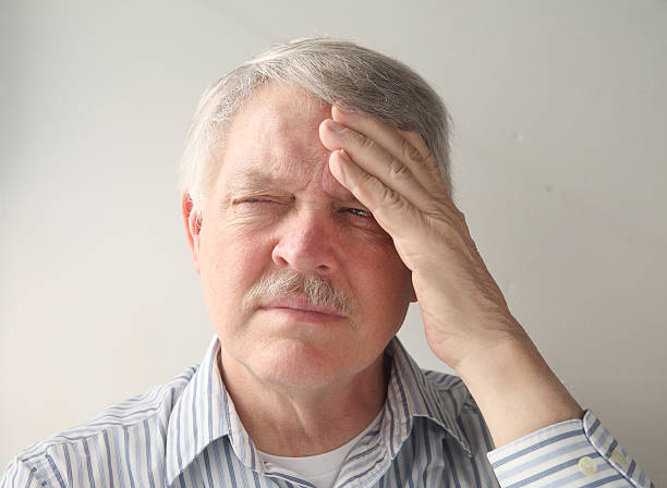 istock older man with head pain 168730366