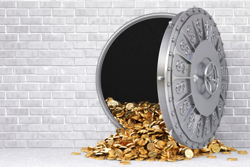 open a bank vault with a bunch of gold coins.