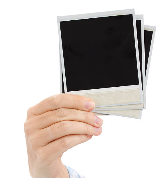 istock hand holding  instant photo 168731531