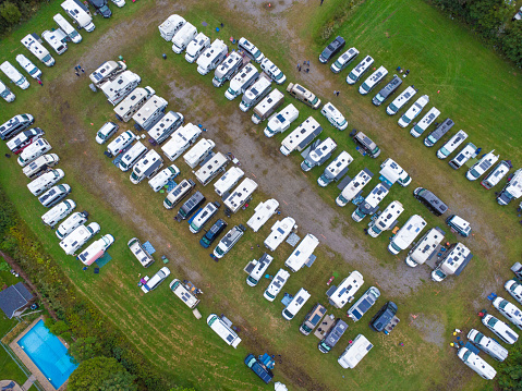 Aerial view of motorhomes gathering in Donnacona field during summer day