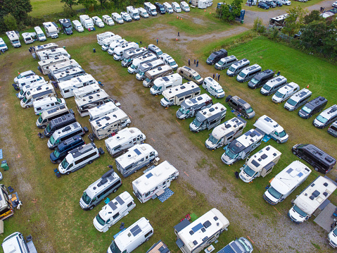 Aerial view of motorhomes gathering in Donnacona field during summer day