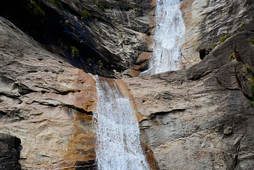 Jiulong Waterfall (Nine Dragons Waterfall) is located in the Huangshan Scenic Area in Anhui Province, China. It is a National 4-A Tourism Scenic Spot and is listed among the seven most famous waterfalls in China. The length of the waterfall is 600 metres, with a drop height of 360 metres. Every waterfall section has several turns with shorter drop sections and pools. Altogether, there are nine folds and, thus, nine pools, hence the name “Nine Dragons Waterfall”.