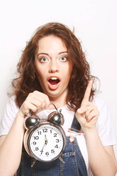 istock woman with alarmclock 1687438453