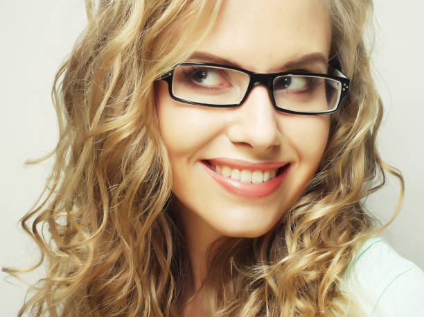 calm and friendly blond woman with glasses