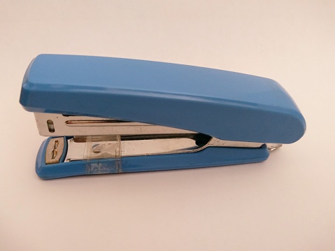 A stapler, stapler, checker, hecter, or jegrekan is a tool for holding together a number of papers by inserting staples in the shape of a folded \