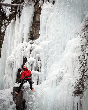 Near Upper Falls, Johnston Canyon, Banff National Park, Alberta, Canada - December 27, 2013 : It was interesting to watch the ice climber.