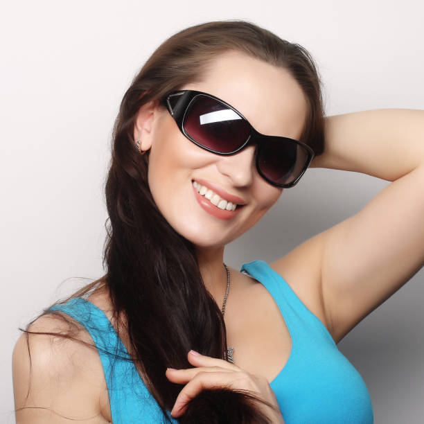 istock brunette portrait with sunglasses 1687500853
