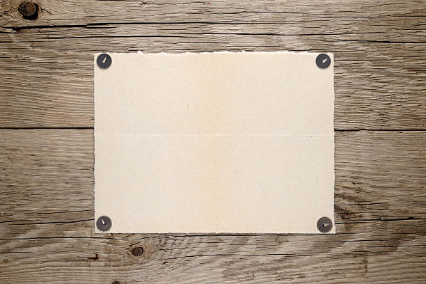 istock Old paper pinned to wooden wall 168757689