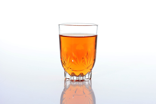 Warm Tea or Teh Hangat on A Clear Glass, Isolated on White. Copy Space for Text