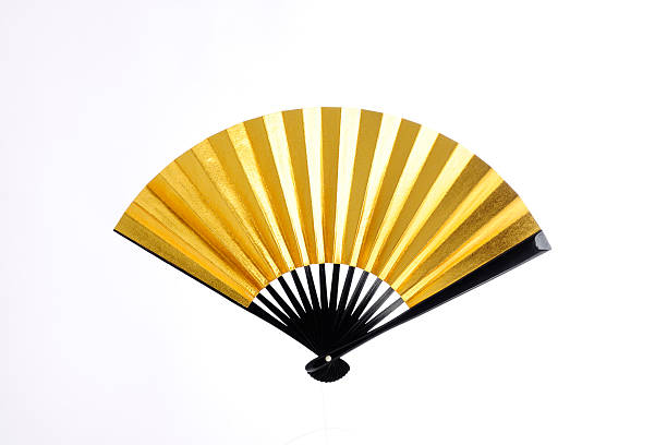 Golden Japanese fan with wooden frame Japanese Fan folding fan stock pictures, royalty-free photos & images