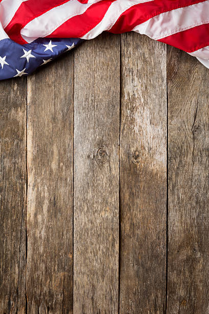 American Flag On Rustic Wooden Background stock photo