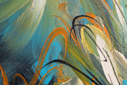 The expressive brushstrokes on this canvas create an artful and dynamic abstract background