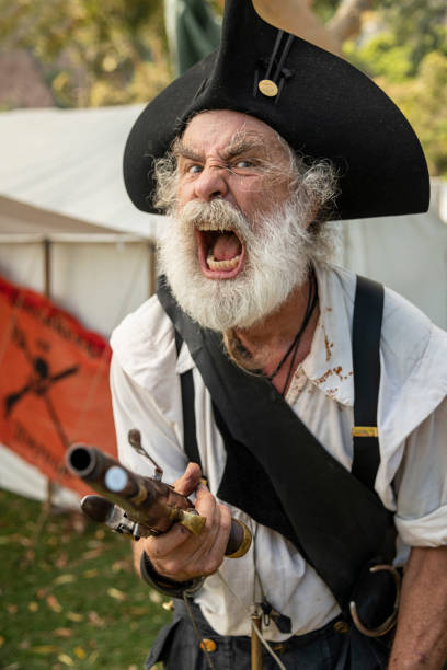 Dana Point, CA, USA - September 9, 2023: A pirate lets out a menacing yell before the battle begins during a hot summer afternoon during the 39th annual maritime festival in Dana Point Harbor.