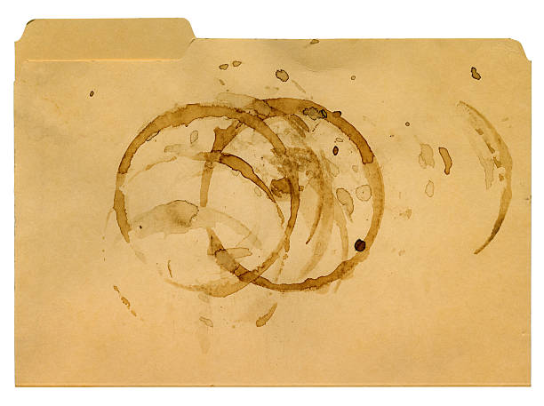 Coffee Stains on a File Folder File folder with coffee stains made by a coffee pot. High resolution scan. old file folder stock pictures, royalty-free photos & images