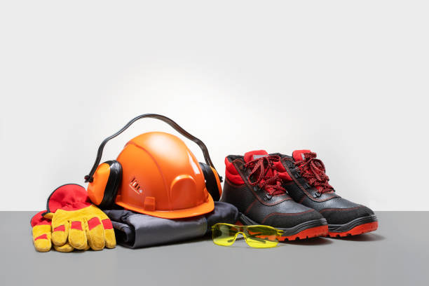 istock Personal protective workwear on grey color surface. safety equipment. 1687637946