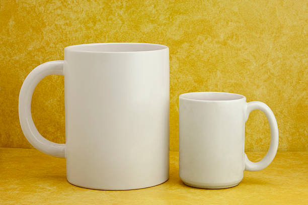 istock Giant and Regular Size Coffee Mugs on Retro Style Counter 168764154