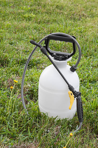 istock Herbicide or pesticide sprayer sits on grass in a yard 168764608