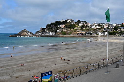 Marazion Cornwall England from St Michael's Mount castle and church with the harbour wall, boats and causeway mainland on a beautiful sunny summer day