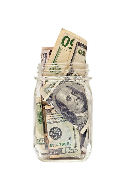 istock U.S. Currency  Stuffed Into Jelly Jar 168765844