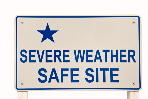 Sign offering a safe site to avoid severe weather. Sign on a public shelter on Tybee Island Georgia, in the southeast USA. Clipping Path included.