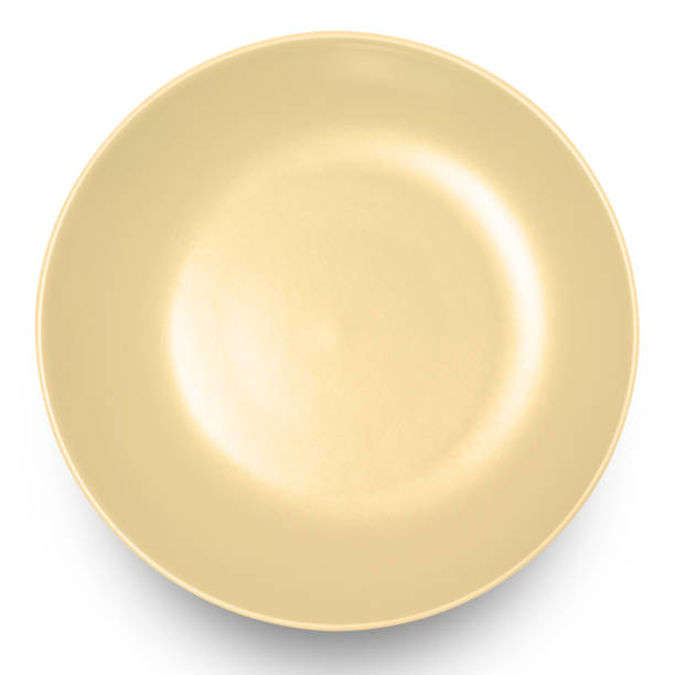 istock Yellow circle ceramics plate isolated on white background. 1687675496