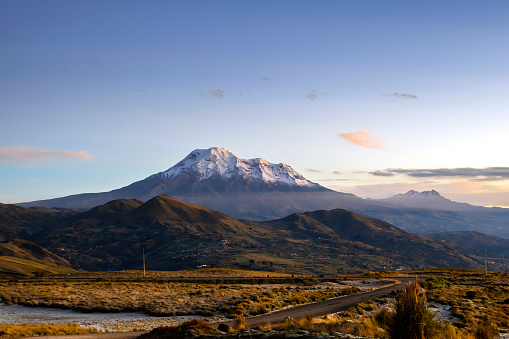 View of the snow-capped Chimborazo at dawn, the closest point to the sun from the earth, you can see the snow-covered peaks.