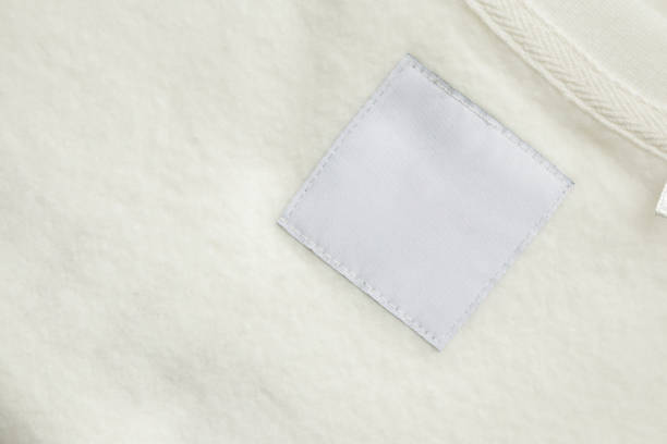 istock Blank white laundry care clothes label on fabric texture background 1687694350