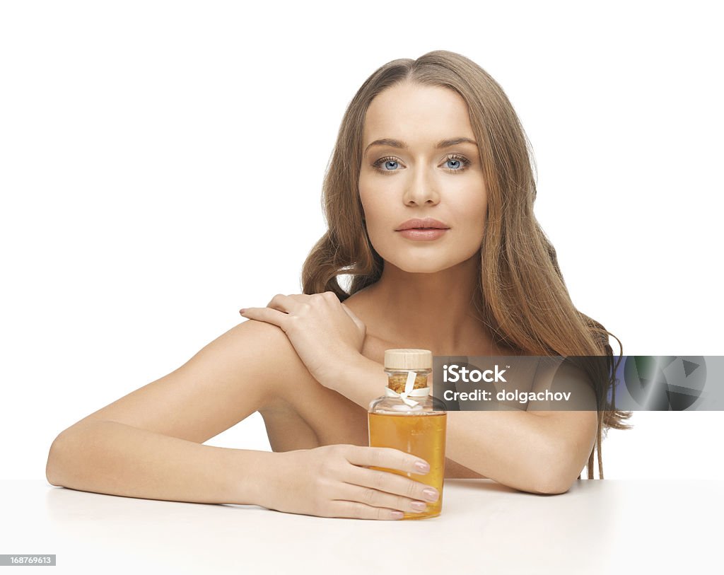 woman with oil bottle picture of beautiful woman with oil bottle Human Face Stock Photo