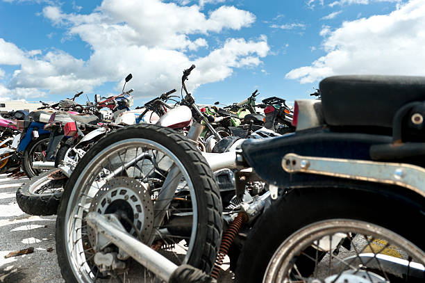 Motorcycles in a scrapyard stock photo