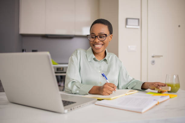 istock Happy young woman is learning online 1687697457