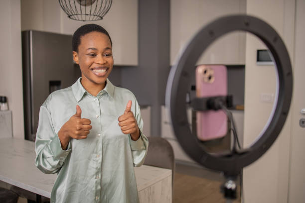 istock Smiling influencer records her podcast 1687698567