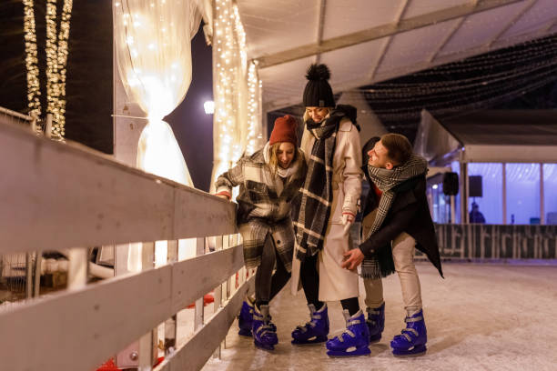 istock Three young friends ice skating together 1687706045