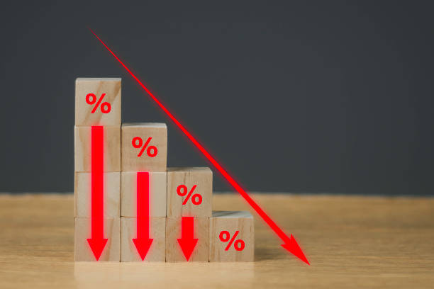 istock Stack wooden blocks with percentage symbol and arrow pointing down.Down Interest rate financial and mortgage rates concept. 1687713421