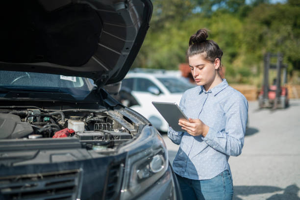 istock Insurance adjuster inspecting damage to vehicle. 1687715838