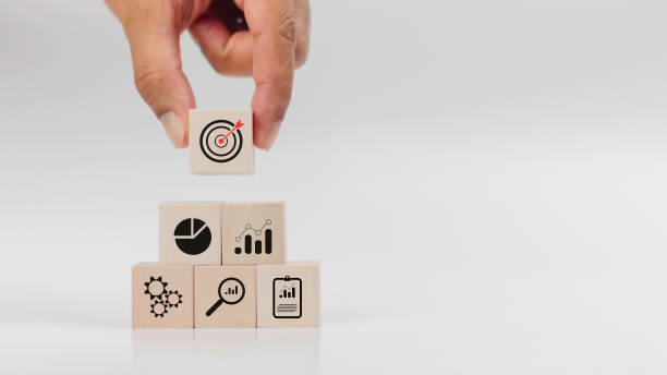 istock Hand stacking wood block with icon about business strategy and action plan on white background . Business development concept with copy space. 1687717512