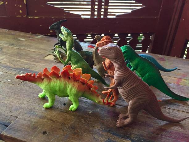 istock dinosaur toys lined up on the table 1687718074