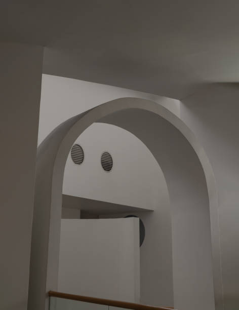 istock Sunlight shines through white arch interior design and white cement wall. 1687729949