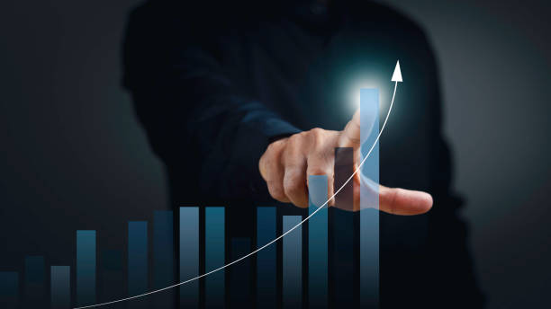 istock Businessman point to analyzing financial graph on virtual screen. Business analysis, financial investment and technology concept. 1687730484