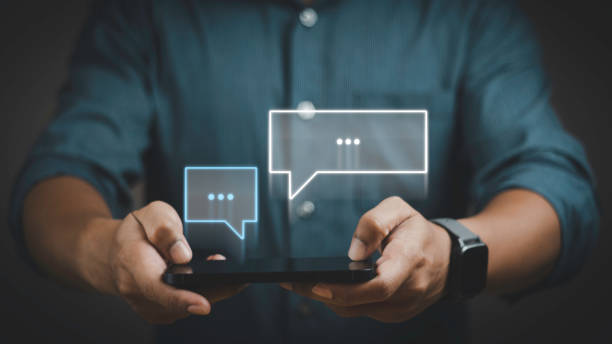 istock Man using smartphone and chatting conversation in chat box pop up. Social media technology concept. 1687730523